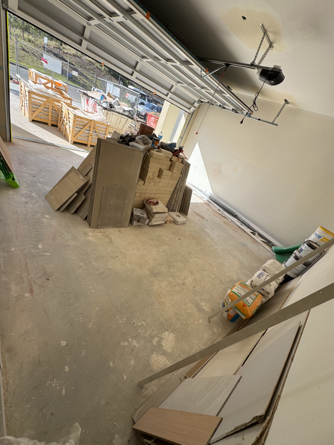 Garage swept with materials neatly stacked after clearance